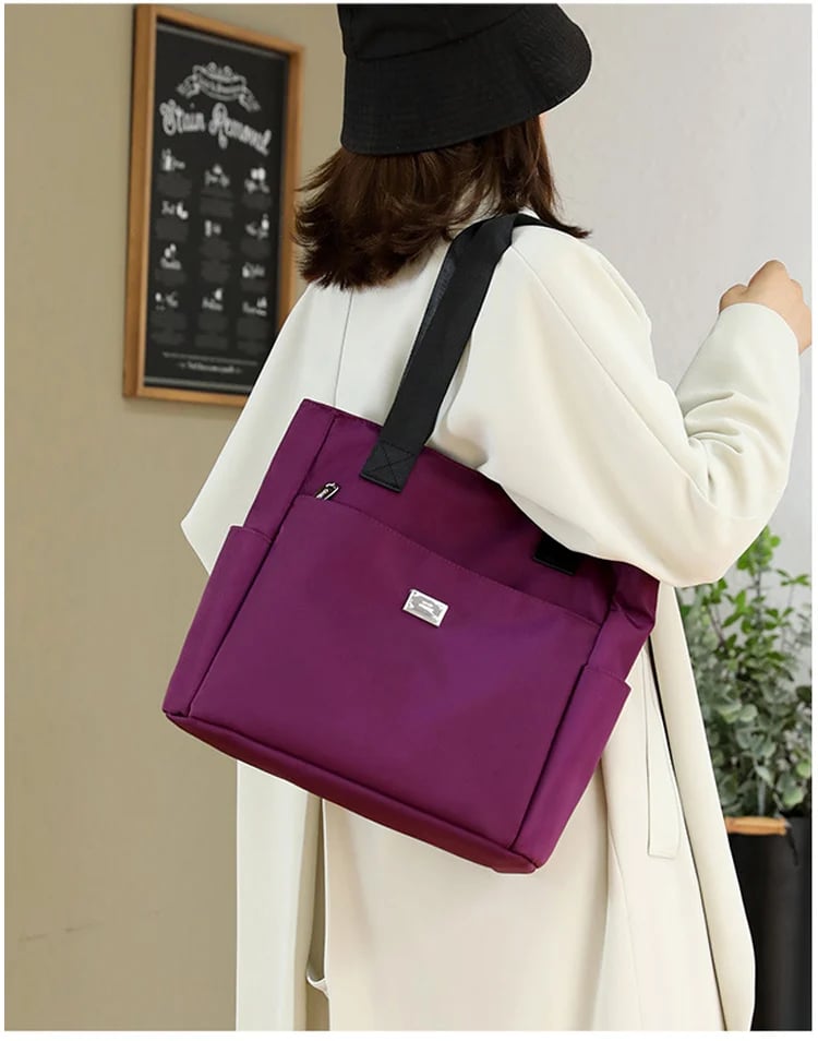 🔥Vattenavvisande axelväska i nylon med flera fickor och stor kapacitet👜